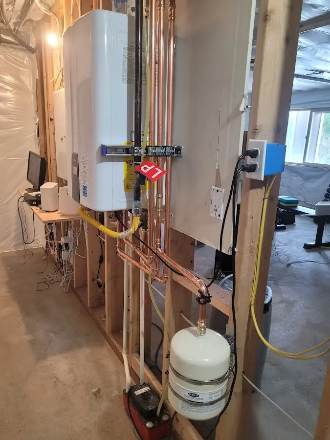 Licensed plumber repairing a kitchen sink in Gentry
